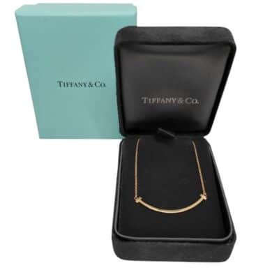 TIFFANY 18K Gold Small T Smile Pendant Necklace.